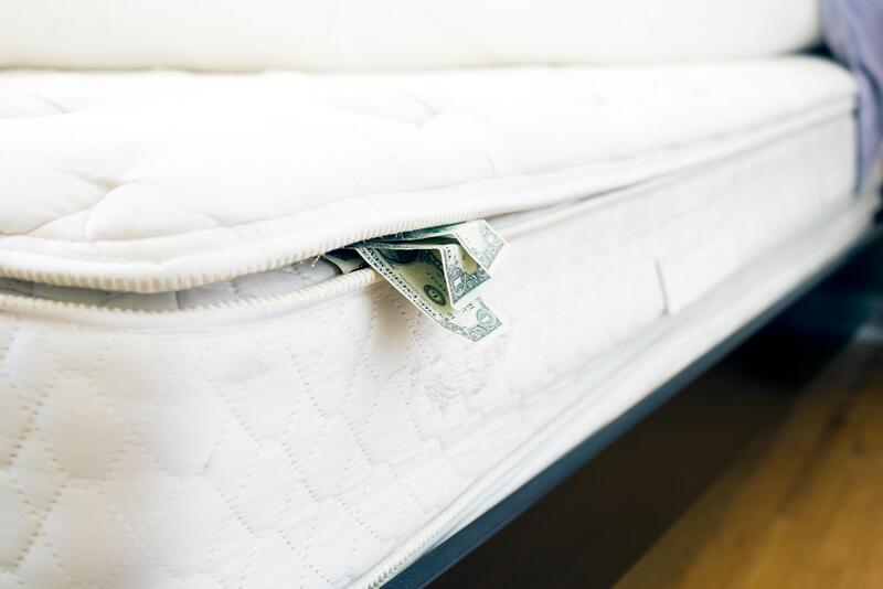 clean white mattress with money
